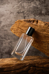 Perfume bottle mockup with wooden background