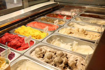 Woman serving ice cream in Confectionery shop