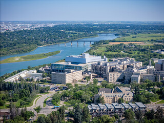 City view with a river running through it and a large hospital in the middle