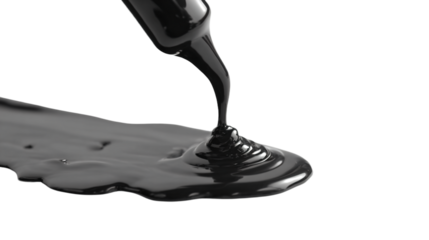 a liquid pouring from a bottle onto a spoon