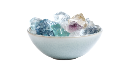 a bowl of crystals on a white background