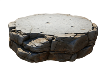 Rough grey stone platform with cracked surface and layered base isolated on a transparent background