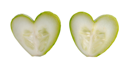 a close up of a sliced apple with a heart shaped cut in half