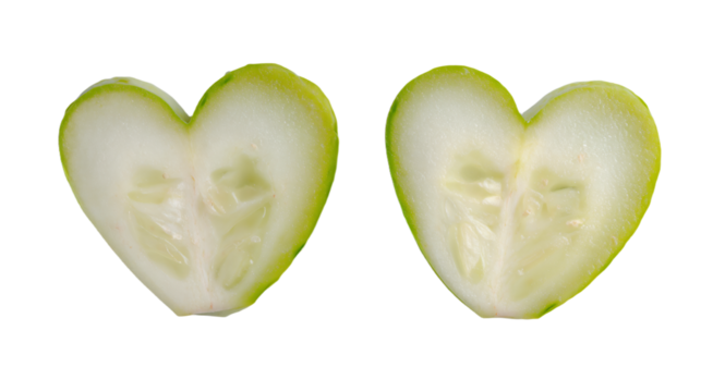 a close up of a sliced apple with a heart shaped cut in half