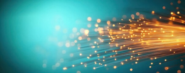 Close-up of glowing fiber optic cables emitting bright orange light points on a blue background symbolizing data transmission and connectivity