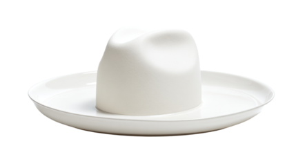 a white hat sitting on top of a white plate