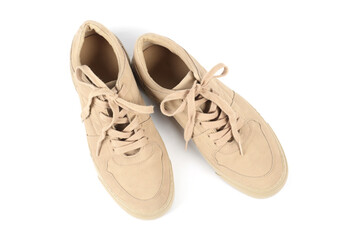 Pair of stylish beige sneakers on white background, top view