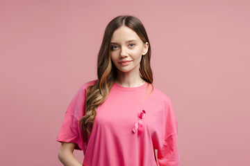Fototapeta premium Woman wearing pink ribbon supporting breast cancer awareness month