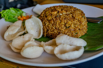 Delicious Indonesian Fried Rice with Crackers and Salad