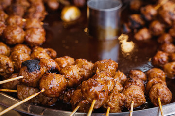Street Food Style Saucy Meatballs on Sticks