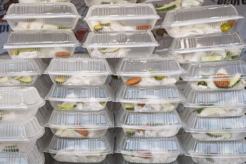 Takeaway Food Stacked in Plastic Containers