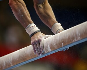 Close-Up of Gymnast’s Chalk-Covered Hands Gripping Beam – Focused Moment of Balance and Strength