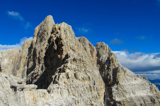 Via delle Bocchette Alte Via ferrata route in the Dolomiti di Brenta Alps in Italy. Equipped with bridge and steel cable and ladder hiking and climbing path in the high rocky mountains in Dolomites