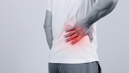 Person experiencing lower back pain with a red highlighted area indicating discomfort and inflammation on a plain background