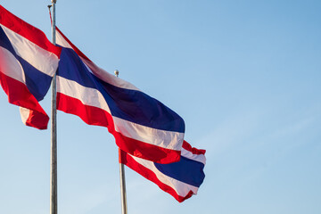 Thailand flag waving at blue sky background.