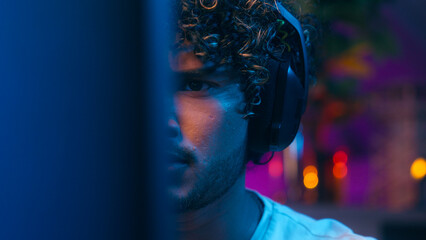 Close up hands keyboard Indian Arabian man player gamer face computer laughter enjoy excited shout exclamation win victory success male guy cyberspace scream cybersport competition tournament gaming