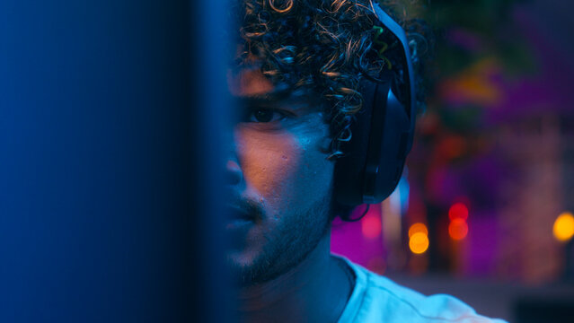 Close up hands keyboard Indian Arabian man player gamer face computer laughter enjoy excited shout exclamation win victory success male guy cyberspace scream cybersport competition tournament gaming - Powered by Adobe