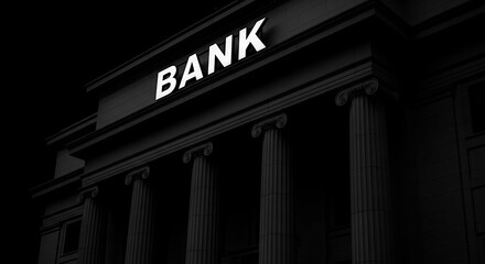 Obraz premium Dramatic black and white shot of a bank building with the word bank illuminated above