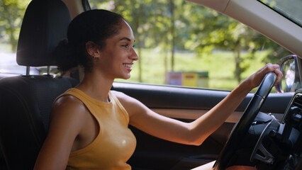 Happy African American woman female girl sit new car smile smiling auto automobile transportation...