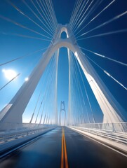 Obraz premium Low-angle shot of a futuristic bridge against a clear blue sky