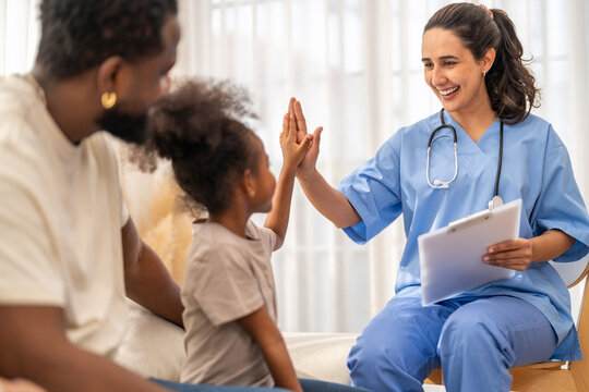 African girl high five with doctor after recovery, happy child leaving hospital healthy, pediatric care success, flu treatment completed, positive experience in children hospital, health insurance
