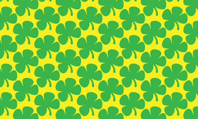 Seamless pattern with floral elements, green leaves, and clover, perfect for a spring or summer wallpaper design