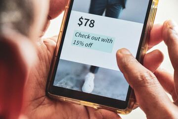 Mobile phone with promotional offer or discount at checkout during online purchase order. Shopping...
