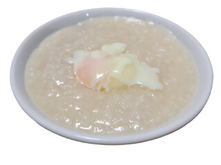 Chinese style minced pork porridge with soft boil egg on top for breakfast isolated on white background 