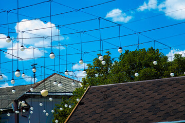 Flashlights and roofs in the town in summer