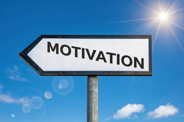 Obraz premium A Signpost Directing Towards Motivation Under a Sunny Sky Symbolizing the Path to Achieving Goals and Finding Inner Drive and Inspiration