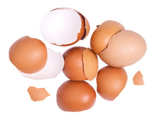 Top view group of broken eggshells stacked on white background.