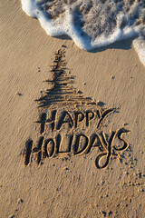 Fototapeta premium Happy Holidays Greeting in Neat Beach Sand Letters with Minimalist One-Line Christmas Tree Beside Words