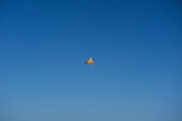 Colorful Kites Flying in Bright Blue Sky