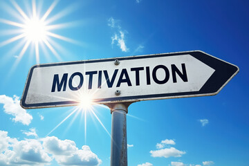 Fototapeta premium Directional Sign Pointing Towards Motivation Under a Bright Sun Against a Blue Sky Symbolizing Guidance and Inspiration for Achieving Goals