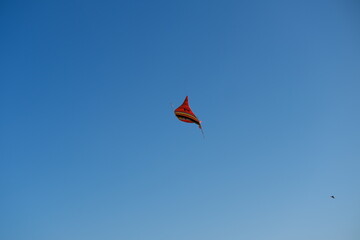 Colorful Kites Flying in Bright Blue Sky