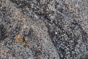 Rough Gray-Blue and White Stone Texture with Yellow Accents – Close-Up Rock Surface for Backgrounds and Design