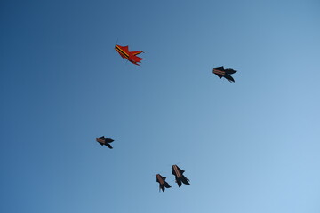 Colorful Kites Flying in Bright Blue Sky