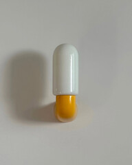 Obraz premium Unlit capsule-shaped yellow and white sconce.