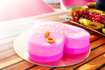 Heart-shaped pink cake with rings