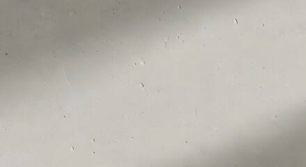 Textured light concrete wall with natural shadows and rough surface imperfections, ideal for architectural renders, backgrounds, and minimalistic design elements