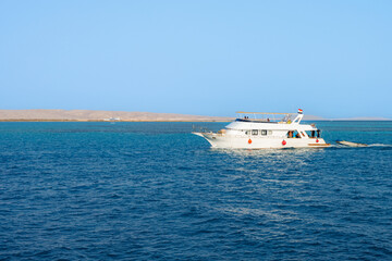 Yacht cruising on clear blue sea