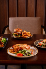 Burger On The Table With Beer And Meals
