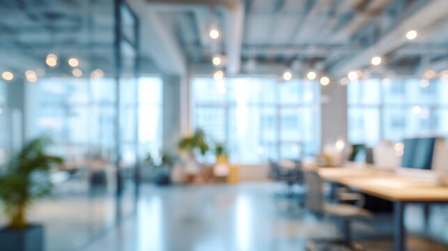 A blurry office space with a few potted plants and a few people sitting at desks. Scene is somewhat chaotic and disorganized, with the blurriness of the photo adding to the sense of disarray