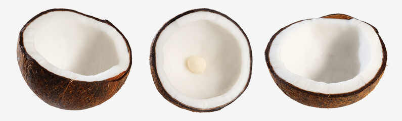 Three halved coconuts with white flesh exposed