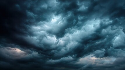 Obraz premium Thick, dark clouds dominate the sky as the sun sets, creating a dramatic, moody atmosphere. The ominous weather signals an impending storm.