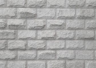 Fototapeta premium fragment of concrete wall made of tiles in grey color.