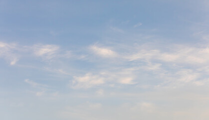 Wispy White Clouds Floating in the Late Afternoon Sky