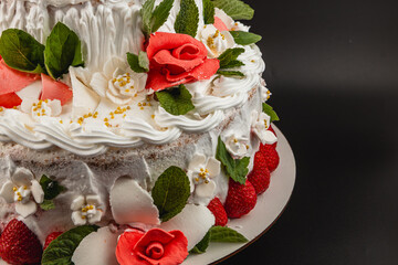 Beautifully decorated cake with strawberries and flowers