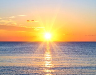 Picturesque seascape at daybreak with sun rays reflecting on the tranquil ocean water