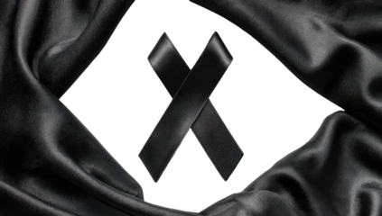 Black mourning ribbons framed by draped black fabric